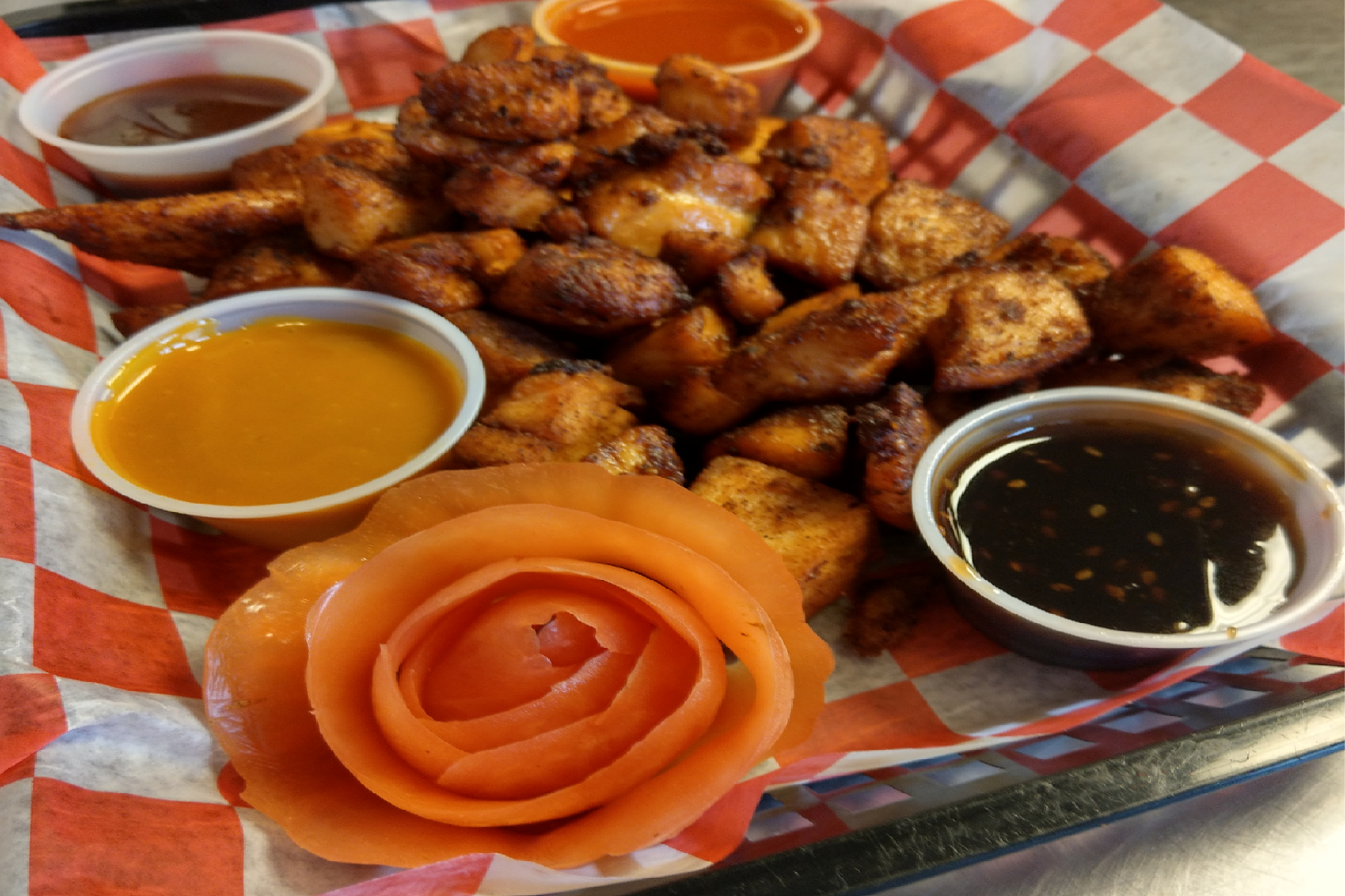 A plate of food with different sauces on it.